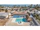 An aerial view of the pool, tiki hut, and landscape of this beautiful home at 2762 W Vina Del Mar Blvd, St Pete Beach, FL 33706