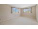 Cozy bedroom with soft carpet, bright windows, and neutral tones providing a blank canvas for personalization at 2762 W Vina Del Mar Blvd, St Pete Beach, FL 33706