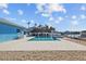 Outdoor pool with tiki hut and waterfront views for relaxing or entertaining guests at 2762 W Vina Del Mar Blvd, St Pete Beach, FL 33706