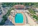 An aerial view shows the community pool, clubhouse and outdoor tennis courts at 3060 Grand Bay Blvd # 154, Longboat Key, FL 34228