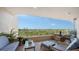 Spacious balcony includes comfortable furniture, an expansive view, and stylish outdoor decor at 3060 Grand Bay Blvd # 154, Longboat Key, FL 34228