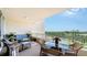 Relax on this condo's balcony with wicker furniture and enjoy peaceful nature views at 3060 Grand Bay Blvd # 154, Longboat Key, FL 34228