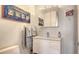 Chic bathroom design with modern vanity, decorative art, and towel warmer at 3060 Grand Bay Blvd # 154, Longboat Key, FL 34228