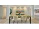 Elegant dining room with a designer table, modern lighting, and a stylish serving buffet at 3060 Grand Bay Blvd # 154, Longboat Key, FL 34228