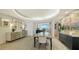 Bright dining room boasts modern lighting, a stylish table, and an elegant display cabinet at 3060 Grand Bay Blvd # 154, Longboat Key, FL 34228