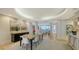 Open-concept dining room with a decorative buffet, modern furnishings, and an abundance of natural light at 3060 Grand Bay Blvd # 154, Longboat Key, FL 34228