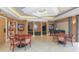 Large community game room with piano, tables, and seating at 3060 Grand Bay Blvd # 154, Longboat Key, FL 34228