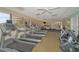 Bright gym with treadmills, exercise bikes, and stability balls overlooking a beautiful tropical landscape at 3060 Grand Bay Blvd # 154, Longboat Key, FL 34228