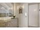 A condo hallway with a decorative chest of drawers and artwork on the wall at 3060 Grand Bay Blvd # 154, Longboat Key, FL 34228