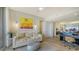 Bright living room featuring modern art, comfortable seating, and access to an outdoor terrace at 3060 Grand Bay Blvd # 154, Longboat Key, FL 34228
