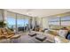 Stylish living room with a waterfront view from the sliding glass doors, and modern decor at 3060 Grand Bay Blvd # 154, Longboat Key, FL 34228