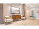 Elegant lobby featuring modern art, plants, lounge chairs, and beautiful floors at 3060 Grand Bay Blvd # 154, Longboat Key, FL 34228
