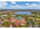Breathtaking aerial view of the community, showcasing the pool, lake, and surrounding homes at 5116 Tivoli Run, Bradenton, FL 34211