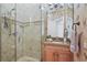 Nicely finished bathroom featuring a glass enclosed shower and designer wallpaper at 7460 Monte Verde, Sarasota, FL 34238