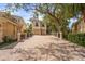 Spacious home exterior featuring a paver driveway, two-car garage, and well-maintained landscaping at 7460 Monte Verde, Sarasota, FL 34238