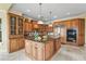 Spacious kitchen featuring custom wood cabinets, granite counters, wine rack, and stainless appliances at 7460 Monte Verde, Sarasota, FL 34238