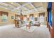 Spacious living room includes a bar, coffered ceilings, and plush seating, great for entertaining guests at 7460 Monte Verde, Sarasota, FL 34238