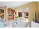 Living room with a wet bar and sliding glass doors that open up to the pool area at 7460 Monte Verde, Sarasota, FL 34238