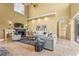 Bright living room with a fireplace, comfortable sofas, and high ceilings with a ceiling fan at 7460 Monte Verde, Sarasota, FL 34238