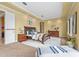 Main bedroom featuring a tray ceiling, ensuite bath and walk in closet at 7460 Monte Verde, Sarasota, FL 34238