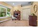 Home office features natural light, neutral walls, and ample space for a desk and storage at 7460 Monte Verde, Sarasota, FL 34238