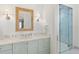 Stylish bathroom with a marble countertop, stylish fixtures, and a frameless glass shower at 8501 Midnight Pass Rd, Sarasota, FL 34242