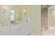 Stylish bathroom featuring a marble vanity, decorative sconces, and glass shower at 8501 Midnight Pass Rd, Sarasota, FL 34242