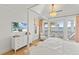 Bright and airy bedroom featuring water views and stylish furnishings at 8501 Midnight Pass Rd, Sarasota, FL 34242