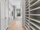 Spacious walk-in closet with custom shelving and ample storage space at 8501 Midnight Pass Rd, Sarasota, FL 34242