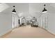 Bright exercise room features vaulted ceiling, light wood floor, and modern equipment perfect for an at-home workout at 8501 Midnight Pass Rd, Sarasota, FL 34242