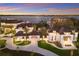 Grand estate featuring a circular driveway and meticulously landscaped grounds, showcasing curb appeal at 8501 Midnight Pass Rd, Sarasota, FL 34242