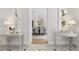 Grand foyer with marble floors, botanical artwork, and view into dining room at 8501 Midnight Pass Rd, Sarasota, FL 34242