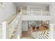 Elegant foyer with a grand staircase and open view to the living room, creating a welcoming atmosphere at 8501 Midnight Pass Rd, Sarasota, FL 34242