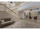 Grand foyer with staircase, high ceilings, decorative tile floor, and a glimpse of the living area at 8501 Midnight Pass Rd, Sarasota, FL 34242