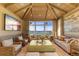 Cozy living room with vaulted ceiling, water views, and custom decor at 8501 Midnight Pass Rd, Sarasota, FL 34242