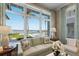 Inviting living room with large windows showcasing waterfront scenery at 8501 Midnight Pass Rd, Sarasota, FL 34242