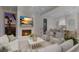 Inviting outdoor living space with fireplace, TV, and comfortable seating area at 8501 Midnight Pass Rd, Sarasota, FL 34242