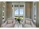 Inviting sitting area with serene waterfront views and elegant furnishings at 8501 Midnight Pass Rd, Sarasota, FL 34242