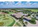 Aerial view of grand clubhouse with well-manicured landscaping and golf course views at 15608 Leven Links Pl, Lakewood Ranch, FL 34202