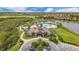 Elegant clubhouse featuring a resort-style pool, manicured landscaping, and convenient parking at 15608 Leven Links Pl, Lakewood Ranch, FL 34202