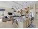 Open-concept kitchen with a large island, stainless steel appliances, and view of the living area at 15608 Leven Links Pl, Lakewood Ranch, FL 34202