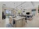 Beautiful kitchen featuring an island, pendant lights, and open views to the spacious living area at 15608 Leven Links Pl, Lakewood Ranch, FL 34202