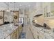 Spacious kitchen with granite countertops, stainless appliances, and light wood cabinets at 15608 Leven Links Pl, Lakewood Ranch, FL 34202