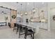 Bright, open kitchen with large island, pendant lighting, and adjacent living spaces at 15608 Leven Links Pl, Lakewood Ranch, FL 34202