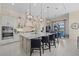 Bright, open kitchen with a large island, pendant lighting, and seating at 15608 Leven Links Pl, Lakewood Ranch, FL 34202