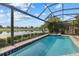 Relaxing pool with spa and picturesque views of the lake and landscape at 15608 Leven Links Pl, Lakewood Ranch, FL 34202