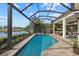 Stunning pool and outdoor area with views of the lake and golf course at 15608 Leven Links Pl, Lakewood Ranch, FL 34202