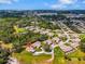 Overhead view of home and surrounding community featuring pond and mature trees at 1817 Curry Ave # 57, Nokomis, FL 34275