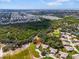 Property aerial view nestled amongst greenery with city skyline visible in the distance at 1817 Curry Ave # 57, Nokomis, FL 34275