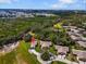 Home aerial view displaying a long driveway and large front yard with established trees at 1817 Curry Ave # 57, Nokomis, FL 34275